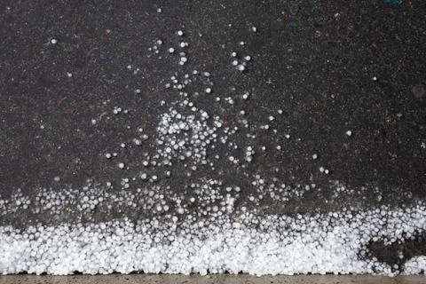 Hail on the pavement after a thunderstorm on summer day Stock Photos
