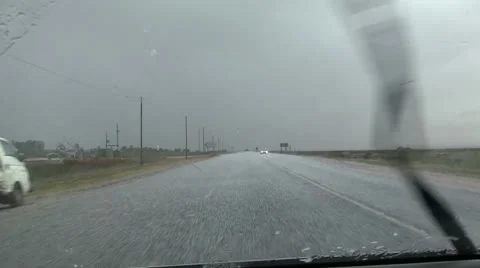 Hail storm while driving in car Stock Footage