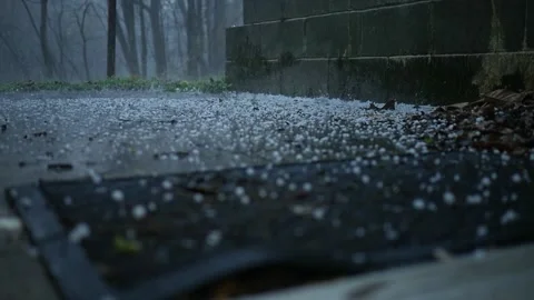 Hail from a thunder storm raining down near residential home Stock Footage 306189770