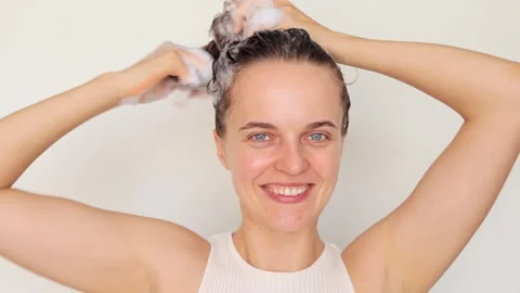 Hair balm application. Refreshing shower routine. Cheerful smiling playful .. Vídeo Stock 251898378