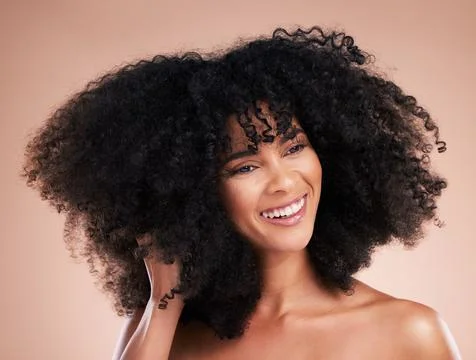 Hair care, black woman and curly texture of a young model with a healthy afro Stock Photos