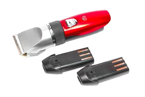 Hair clipper, two replaceable batteries on a white background Stock Photos