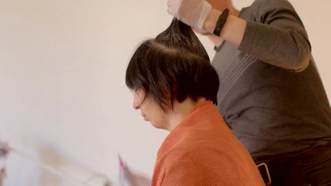 The Hair Coloring Process A Client Enjoying Time in a Salon with a Stylist Stock Footage 311118544