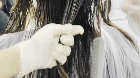 Hair combing in salon, horizontal close-up Stock Footage 345136383