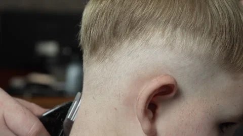 Hair cutting at the back of the head with a machine. Stock Footage 274469503