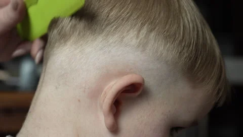 Hair cutting at the back of the head with a machine. Stock Footage 276183405