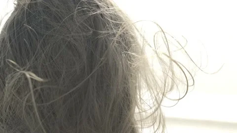 Hair develops in the wind close-up.  Summer light mood Video stock 235890738