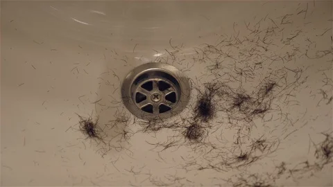 Hair falling into the sink Stock Footage 129626970