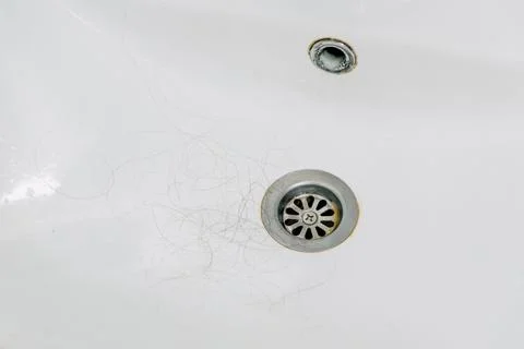 Hair loss problem when combing head, broken dry damaged hair on brush and sin Stock-Fotos