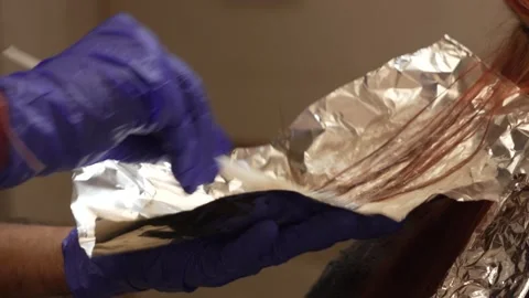Hair Pack Process During Silver Foil Coloring in Salon Stock Footage 318769362