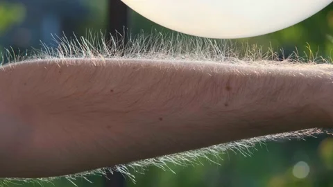 Hair rises from static electricity. An example of static electricity. Stock Footage 195359093