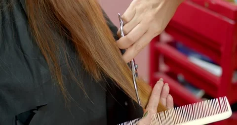 Hair slides will get dimensional,flowing hair.The tools used are scissors. Stock Footage 222616634