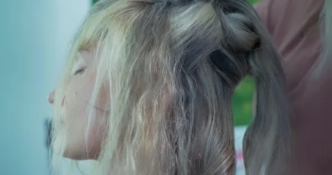 Hair Styling Process in Salon Setting 動画素材 323492341