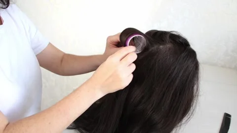 Hair Styling Training with Velcro Rollers on Mannequin Head Stock Footage 309881126
