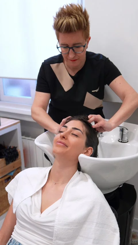 Haircare Expert Gently Preparing Client for Stem Cell Hair Therapy Stock Footage 271351046