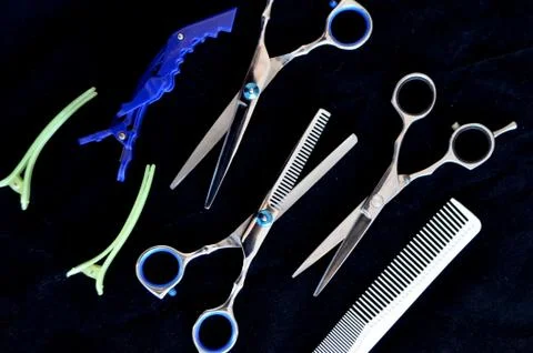 Haircuts, scissors and combs Stock Photos