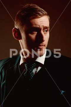 Hairdo concept. Man in classy wear and hairdo. Handsome man with blond hair Stock Photos