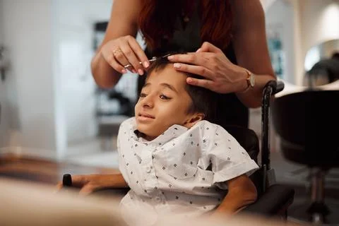 Hairdresser, disability and wheelchair handicap child with cerebral palsy Stock Photos