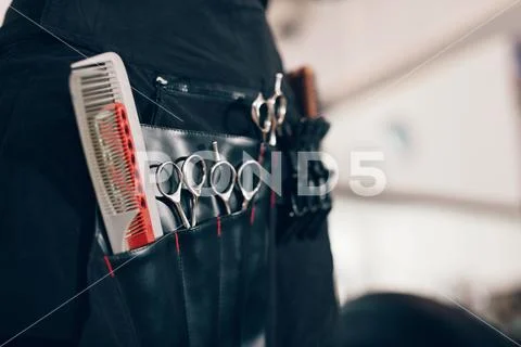 Hairdressing accessories arranged in compartments of a salon hol Stock Photos
