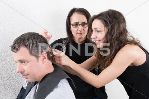Hairdressing and trainees learning the barber profession Stock Photos