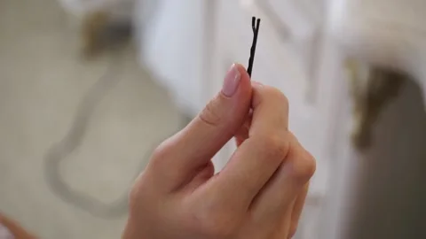 Hairpin in hand Stock Footage 159897785