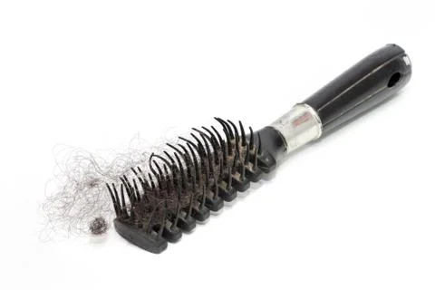 Hairs fall with a comb and problem hair on white background Stock Photos