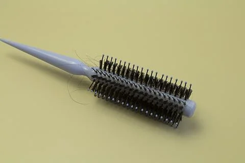 Hairs fall in comb. brushing with loose hair, from health problems. concept.. Stock-Fotos