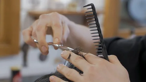 Hairstylist  at work Stock Footage 104876379