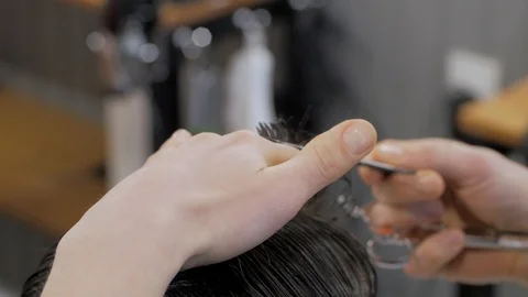 Hairstylist  at work Stock Footage 104876381