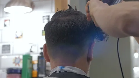 Hairstylist  at work Stock Footage 104876412