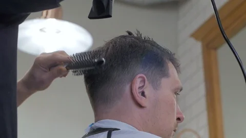Hairstylist  at work Stock Footage 104876432
