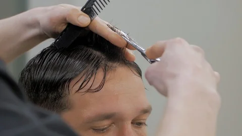 Hairstylist  at work Stock Footage 104876433