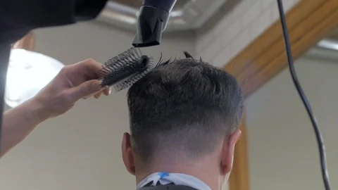 Hairstylist  at work Stock Footage 104876440