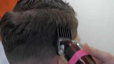 Hairstylist  at work Stock Footage 104876449