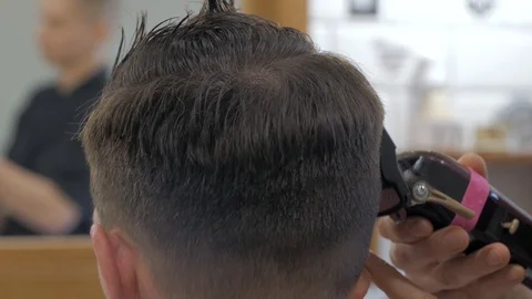 Hairstylist  at work Stock Footage 104876495