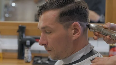 Hairstylist  at work Stock Footage 104876518