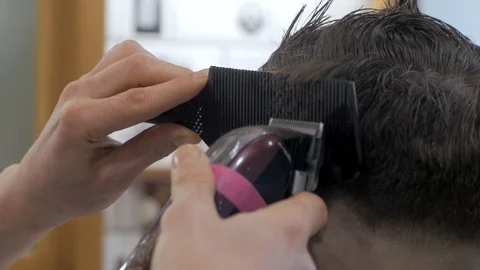 Hairstylist  at work Stock Footage 104876533