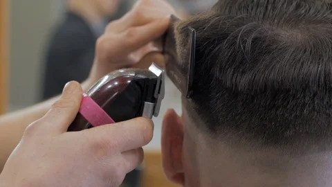 Hairstylist  at work Stock Footage 104876546