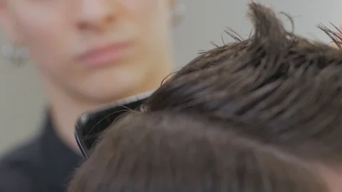 Hairstylist  at work Stock Footage 104876576