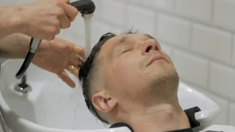 Hairstylist  at work Stock Footage 104876643