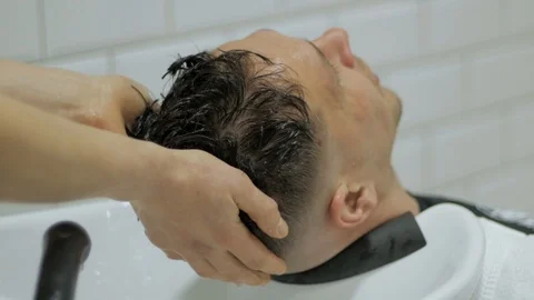 Hairstylist  at work Stock Footage 104876647