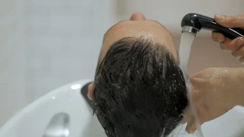 Hairstylist  at work Stock Footage 104876679
