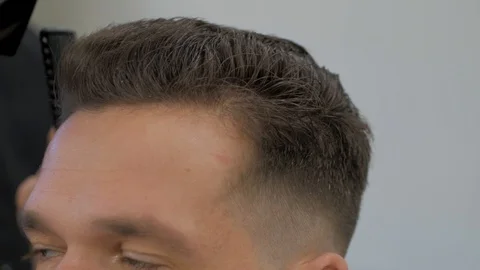 Hairstylist  at work Stock Footage 104876680