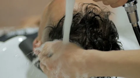 Hairstylist  at work Stock Footage 104876762