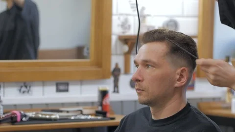 Hairstylist  at work Stock Footage 104876763