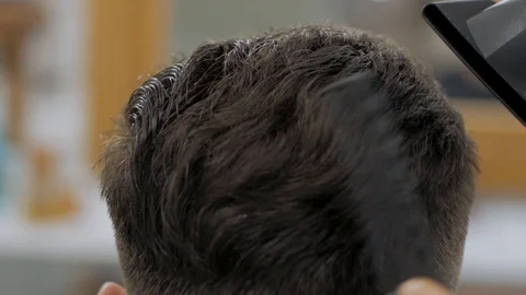 Hairstylist  at work Stock Footage 104876767