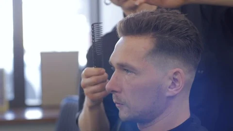 Hairstylist  at work Stock Footage 104876769