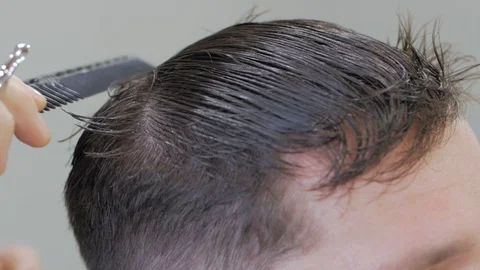 Hairstylist  at work Stock Footage 104876832