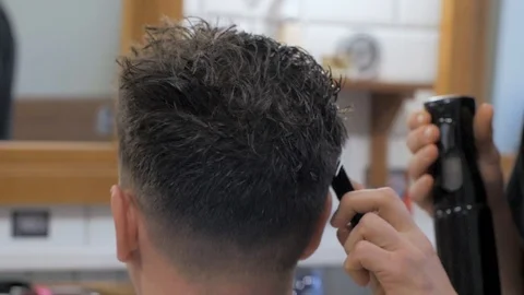 Hairstylist  at work Stock Footage 104876844