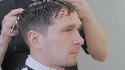 Hairstylist  at work Stock Footage 104876912